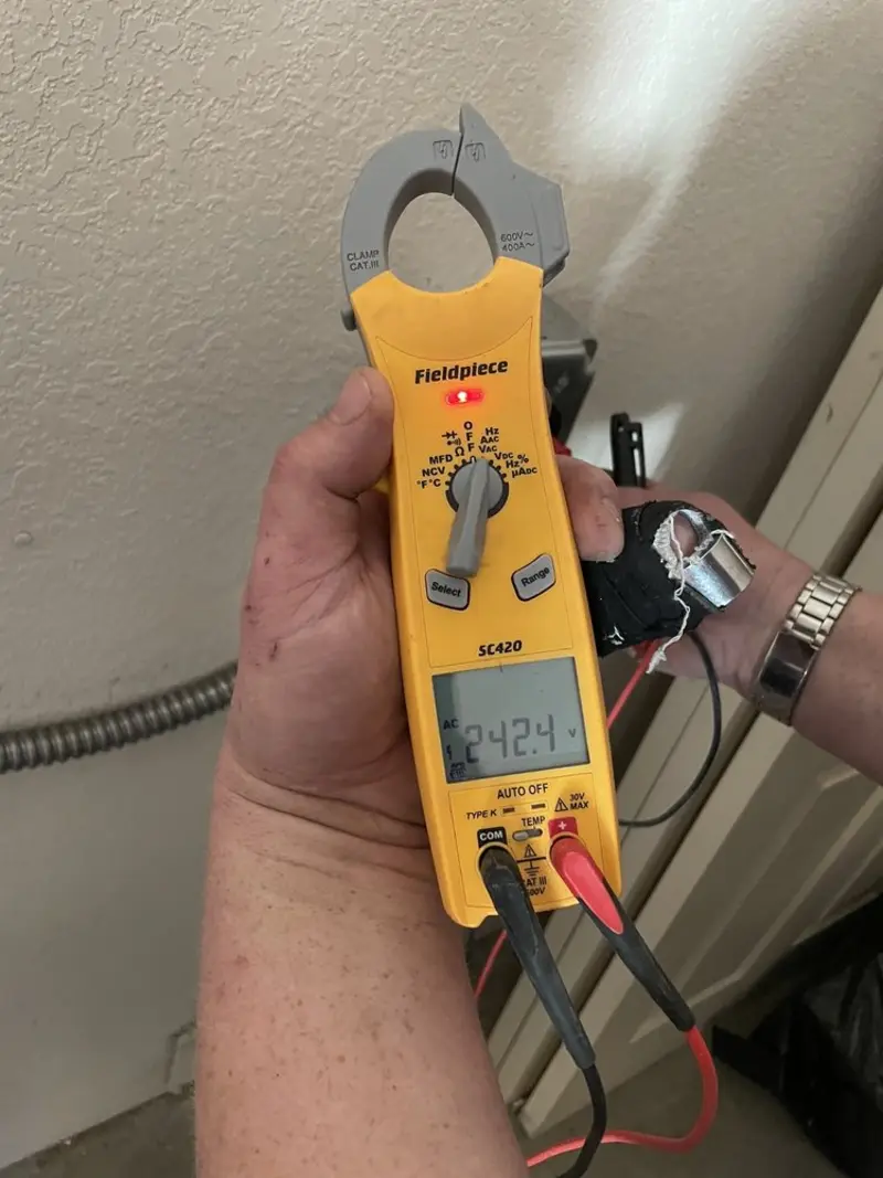 Voltage testing with clamp meter during Outlet Installation in Enterprise